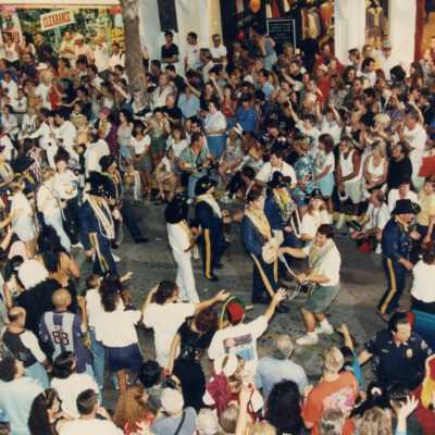 Unknown people walking in the parade.