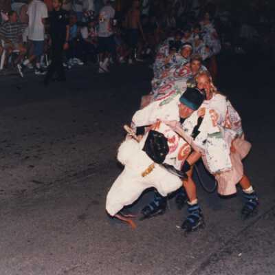 Unknown people roller blading during the parade.