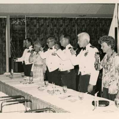 Unknown people at a party saluting