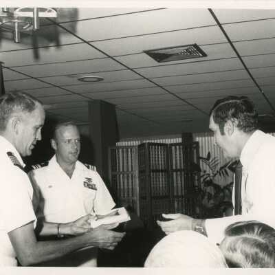 Unknown men in uniform talking