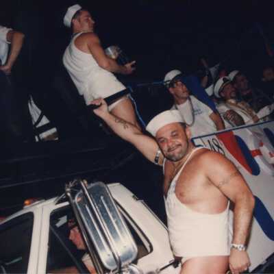 Unknown people dressed up on a float.