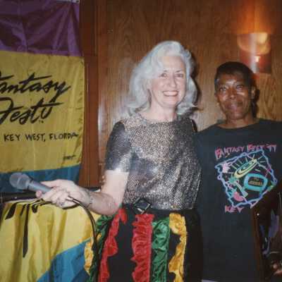 Two unknown woman at an award ceremony.