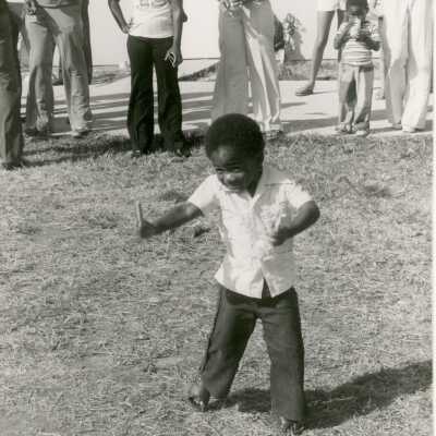 An unknown child dancing outside