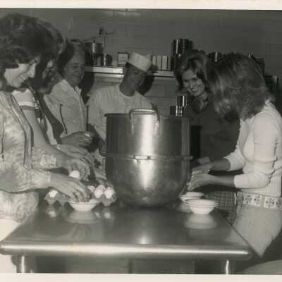 Unknown woman in a kitchen mixing food