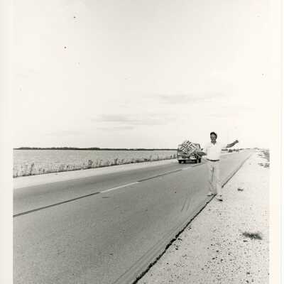 Unknown man holding up an election sign on US 1