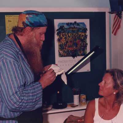 Two unknown people talking about a face mask.