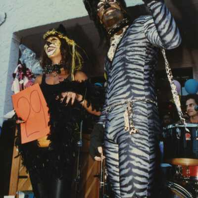 Two unknown people dressed up.