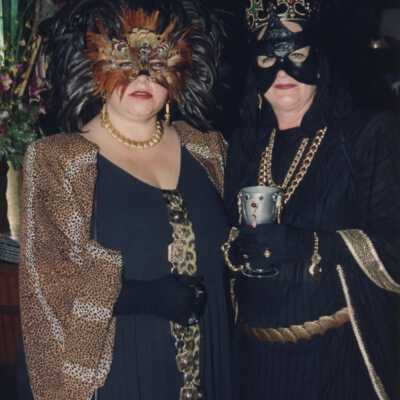 Two unknown people dressed up.