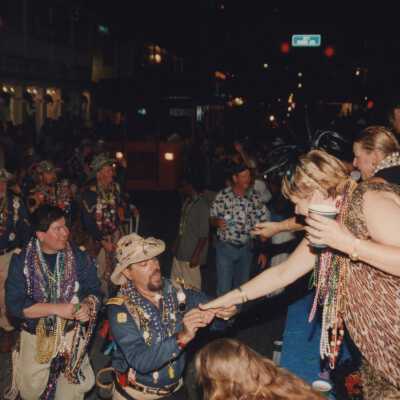 Unknown people walking in the parade.