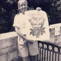 An unknown woman holding up a drawing that reads FF 92.