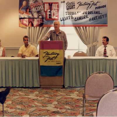 Unknown man speaking at the Fantasy Fest meeting.