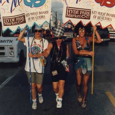 Unknown people holding signs for the masquerade march.
