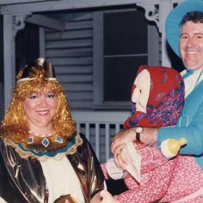 Two unknown people dressed up.