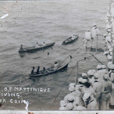 Natives of Martinique diving for coins