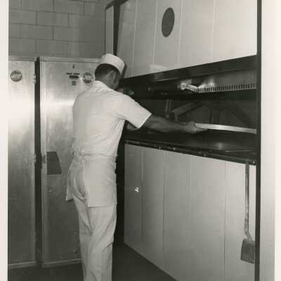 U.S. Navy man working in the kitchen