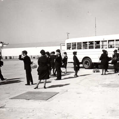 Military members and a bus