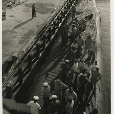 Unknown people standing on a ship