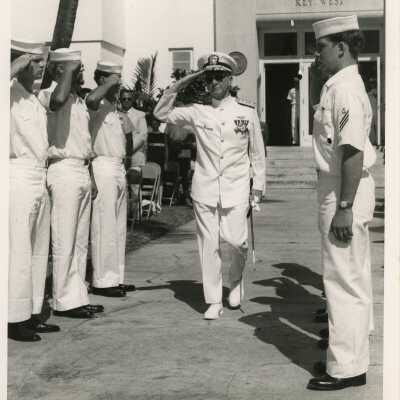 Men in uniform saluting