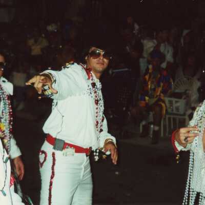 Unknown people dressed up as Elvis.