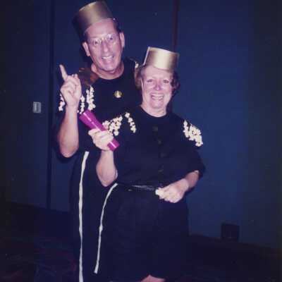 Two unknown people dressed up.