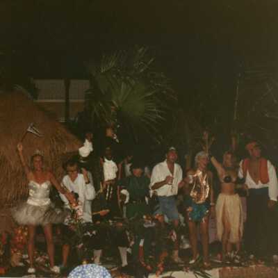 Unknown people dressed up on a stage.