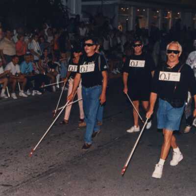 Unknown people walking in the parade.