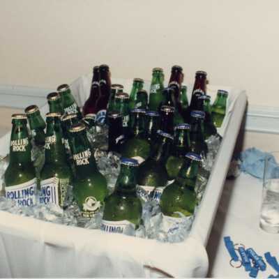 A bin holding rolling rock beer.