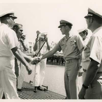Unknown men in uniform shaking hands