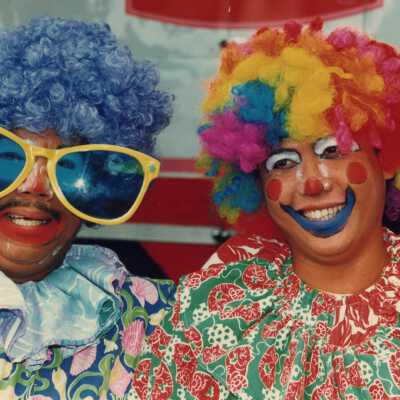 Two unknown people dressed up.