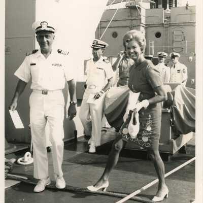 U.S. Navy men and an unknown woman