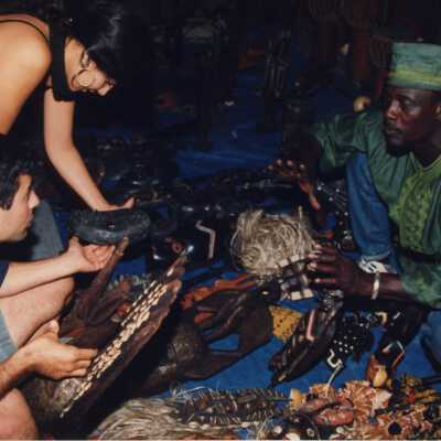 Unknown people looking at items at a Goombay booth.