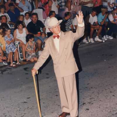 Unknown man dressed up walking in the parade.