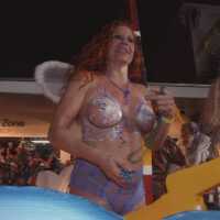 An unknown woman dressed up with her breast painted.
