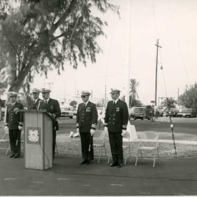 Unknown men at a ceremony