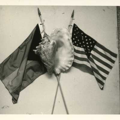 Conch Shell with Bahamian Flag and American Flag