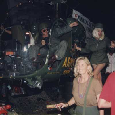 Unknown people on a float that is an Army helicopter.