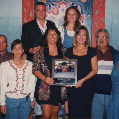 Unknown group of people with a plaque.