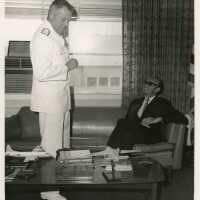 2 Men talking in an office