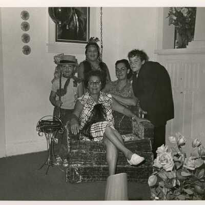 Unknown woman and children in a house