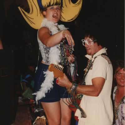 Unknown people dressed up on a float.