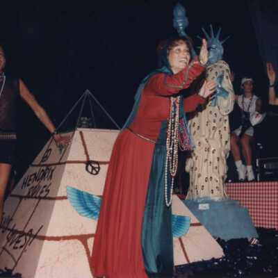 Unknown people dressed up on a float.