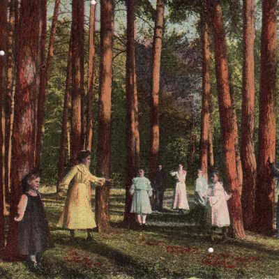 Family standing beneath trees