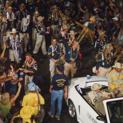 Unknown people walking in the parade.