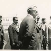 A group of men in suits standing