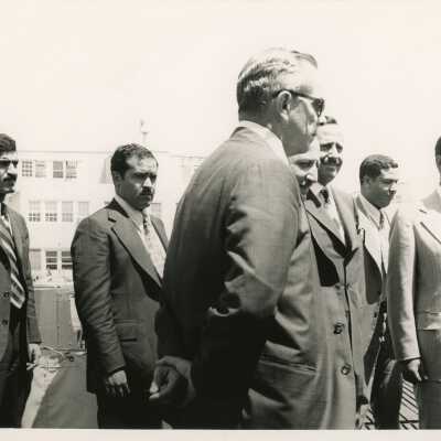 A group of men in suits standing