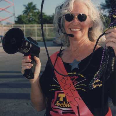 Unknown lady with an ear piece on and a loud speaker.