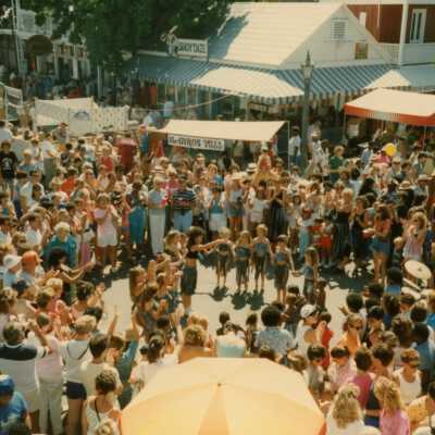 A huge group of unknown people standing on Duval and Green Street.