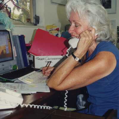 Unknown woman talking on the phone in an office.