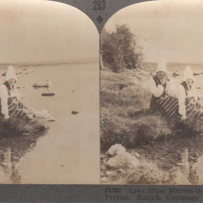 Stereoview of women by a lake wearing Swedish costumes