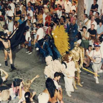 Unknown people walking in the parade.